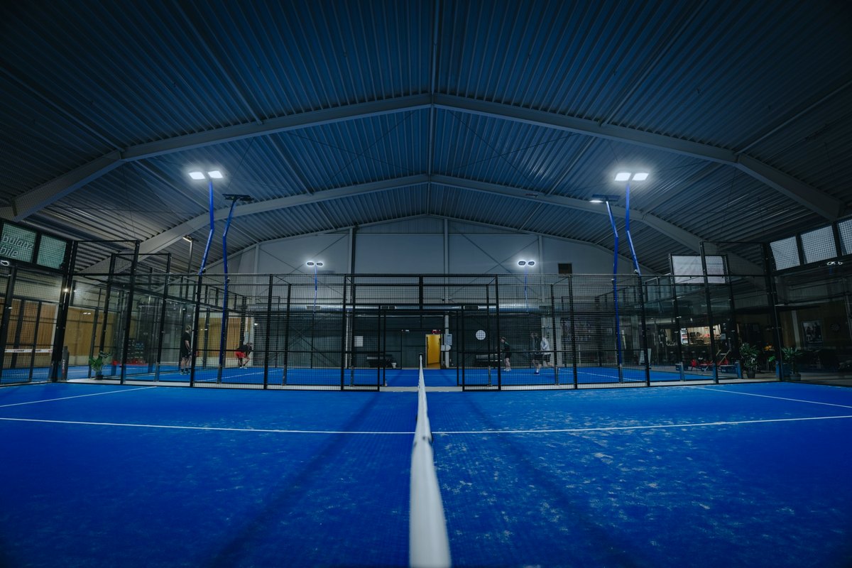 View from the net post along the centre line of a court at Padel Planet