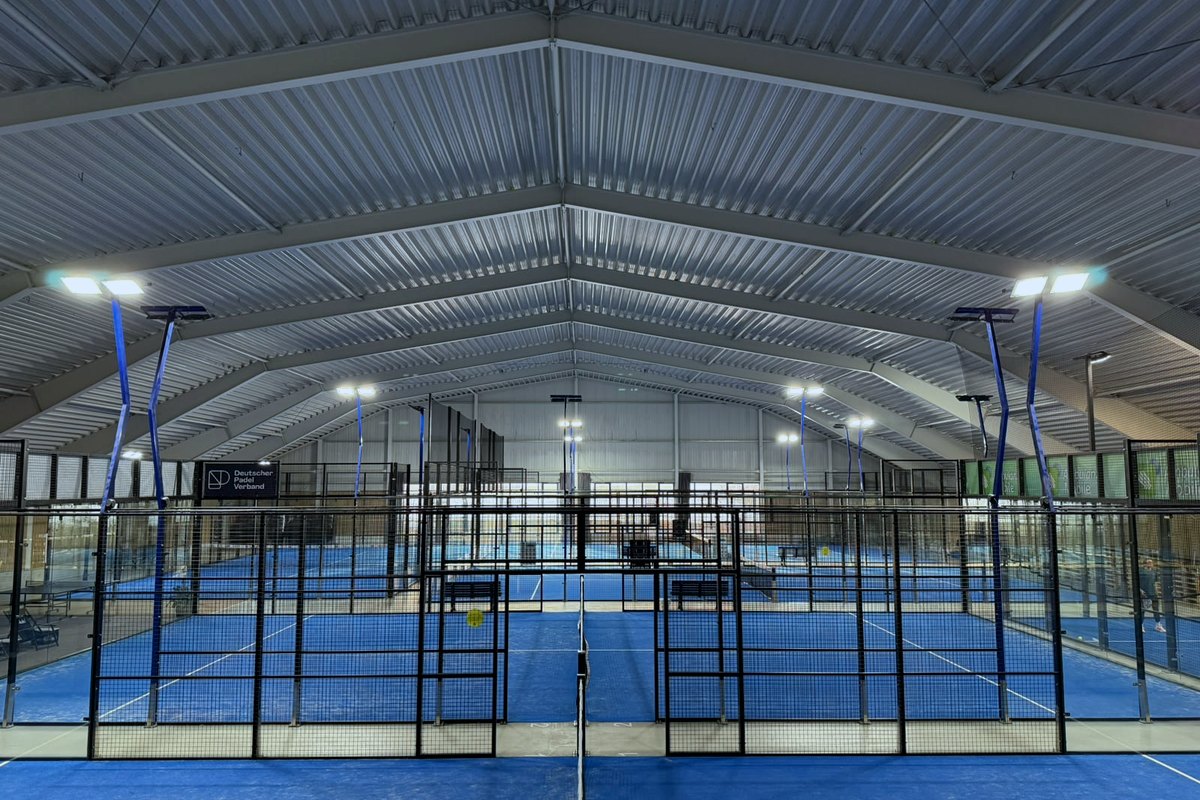 View across the courts inside the Padel Planet hall, under the roof
